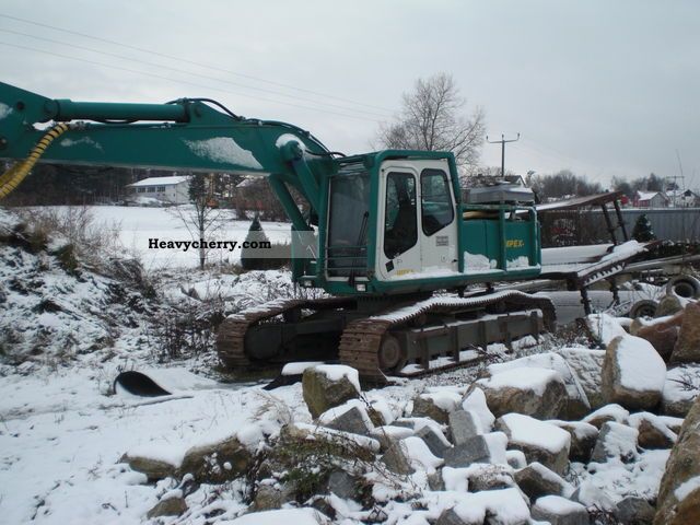 1995 Atlas  1704 m. Harvester head Construction machine Caterpillar digger photo