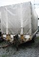 Dinkel  DME 10000 2-axle tandem trailer 1993 Stake body and tarpaulin photo