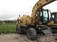 2003 CAT  M316C Year 2003/9500 h / mono / Sw / shield / claw Construction machine Mobile digger photo 1