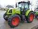 2011 Claas  ARION 610C Agricultural vehicle Tractor photo 1