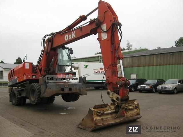 1997 O & K  MH with outriggers 6 4 Construction machine Mobile digger photo
