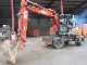 O & K  MH City 4 spoons + Hammer MS 10 2002 Mobile digger photo