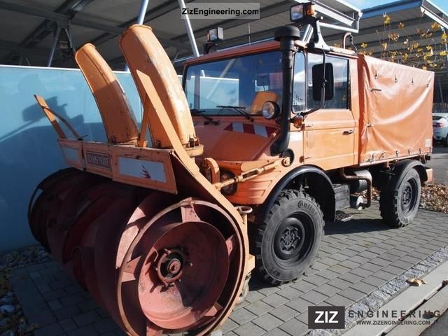 1990 Unimog  U650 with snow blower Van or truck up to 7.5t Stake body and tarpaulin photo