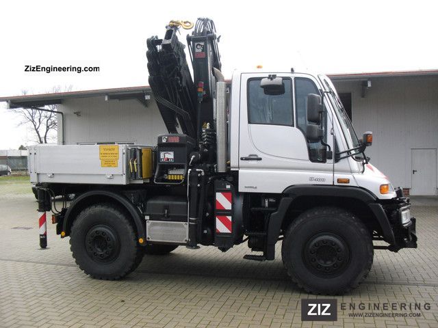2009 Unimog  U 400 with a HIAB XS 122-4, fully equipped, radio Truck over 7.5t Truck-mounted crane photo