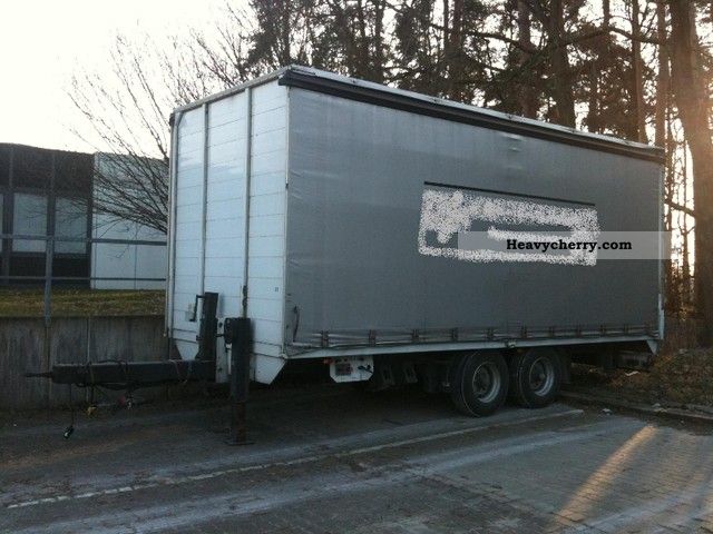 2004 Krukenmeier  Tandem Trailer Stake body and tarpaulin photo