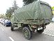 1986 Mercedes-Benz  Unimog 1300 4x4 army tarpaulin bows Van or truck up to 7.5t Stake body and tarpaulin photo 3