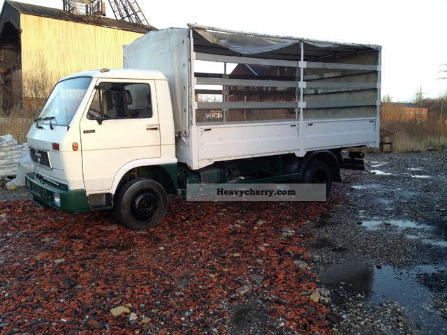 1991 MAN  9150 Van or truck up to 7.5t Stake body and tarpaulin photo