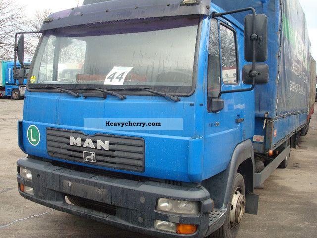 2003 MAN  8220 Truck over 7.5t Stake body and tarpaulin photo
