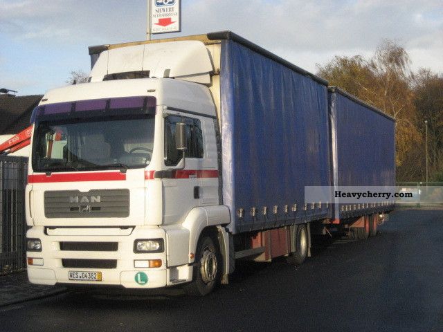 2002 MAN  TGA 410 Articulated vehicle with tandem trailer Truck over 7.5t Stake body and tarpaulin photo