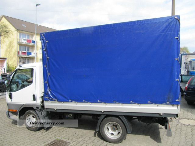 2004 Mitsubishi  canter Van or truck up to 7.5t Stake body and tarpaulin photo