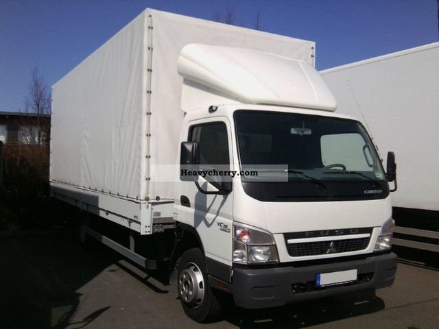 2010 Mitsubishi  Canter 7C15 Van or truck up to 7.5t Stake body and tarpaulin photo