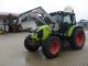 2010 Claas  Axos 330 CX-wheel drive with front loader Agricultural vehicle Tractor photo 1