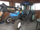 New Holland  TN 75 FA with Stoll FL 2006 Tractor photo